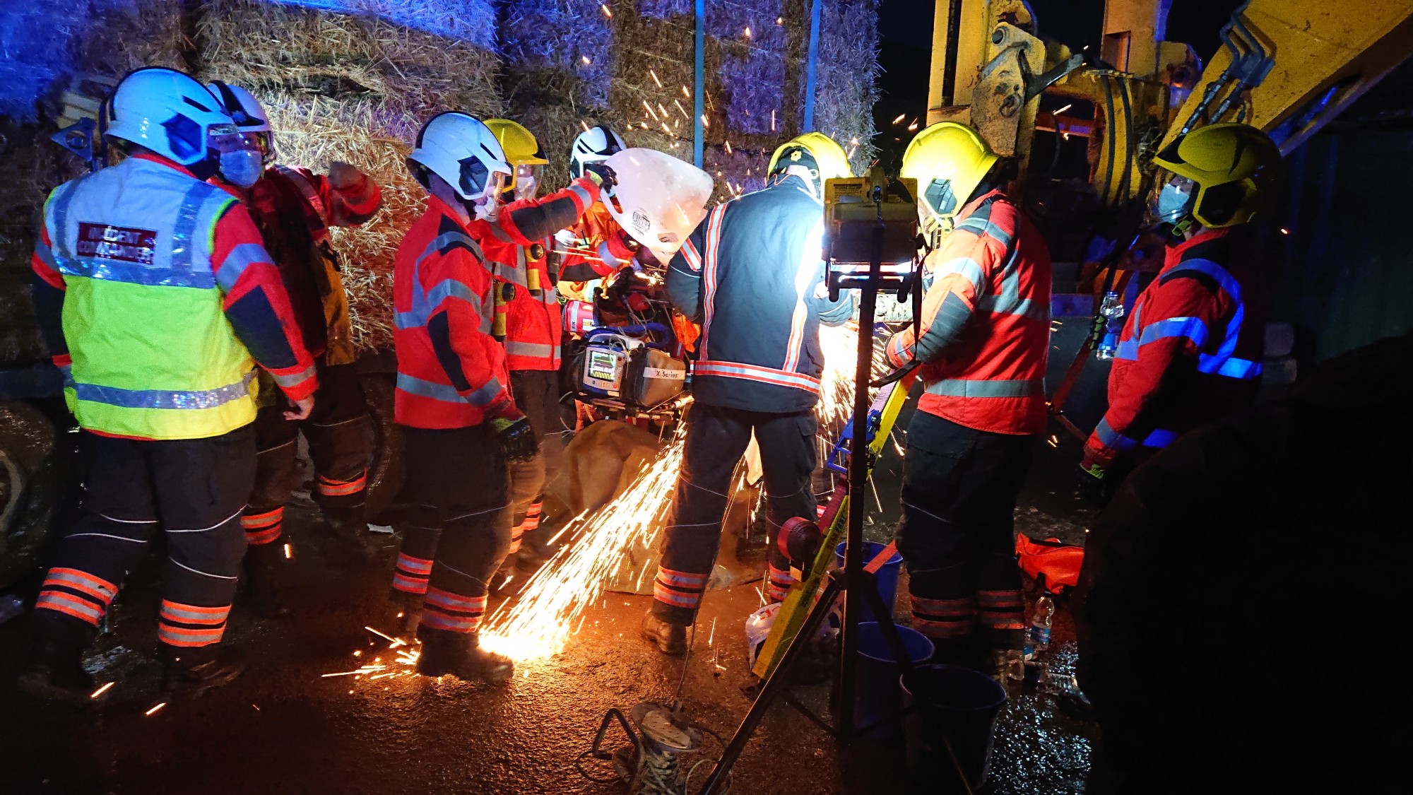 Jonathan Willis being cut free from the forklift by the emergency services at the scene.