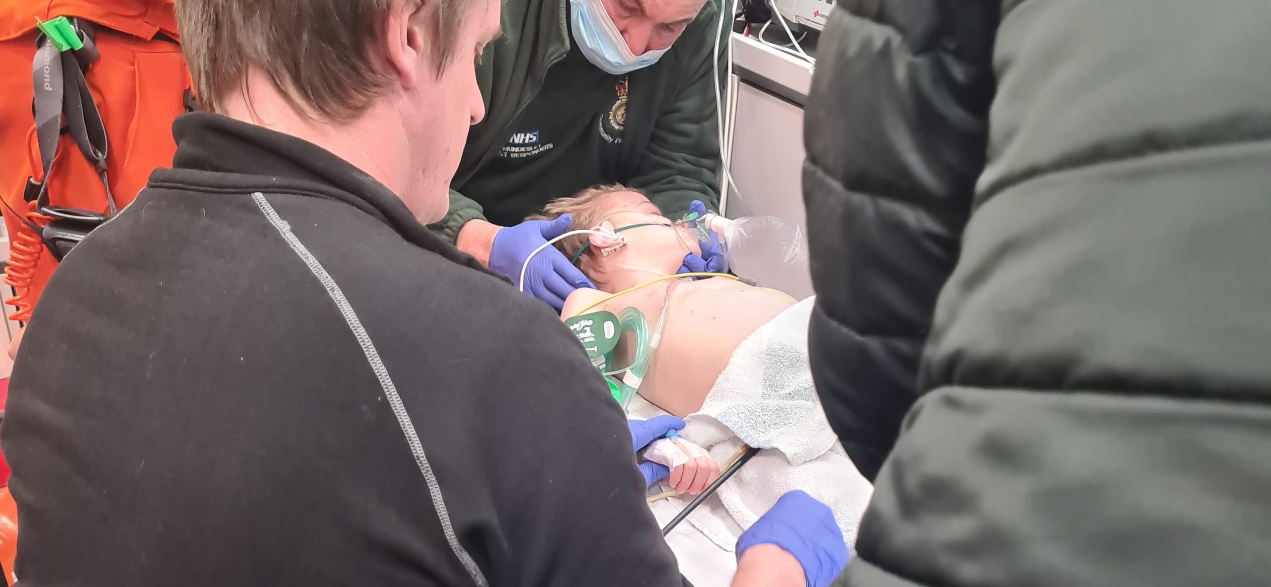 Patient Albie is treated in the back of an ambulance by the EAAA crew.