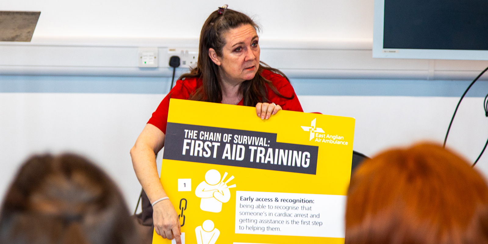 CPR trainer teaching the chain of survival