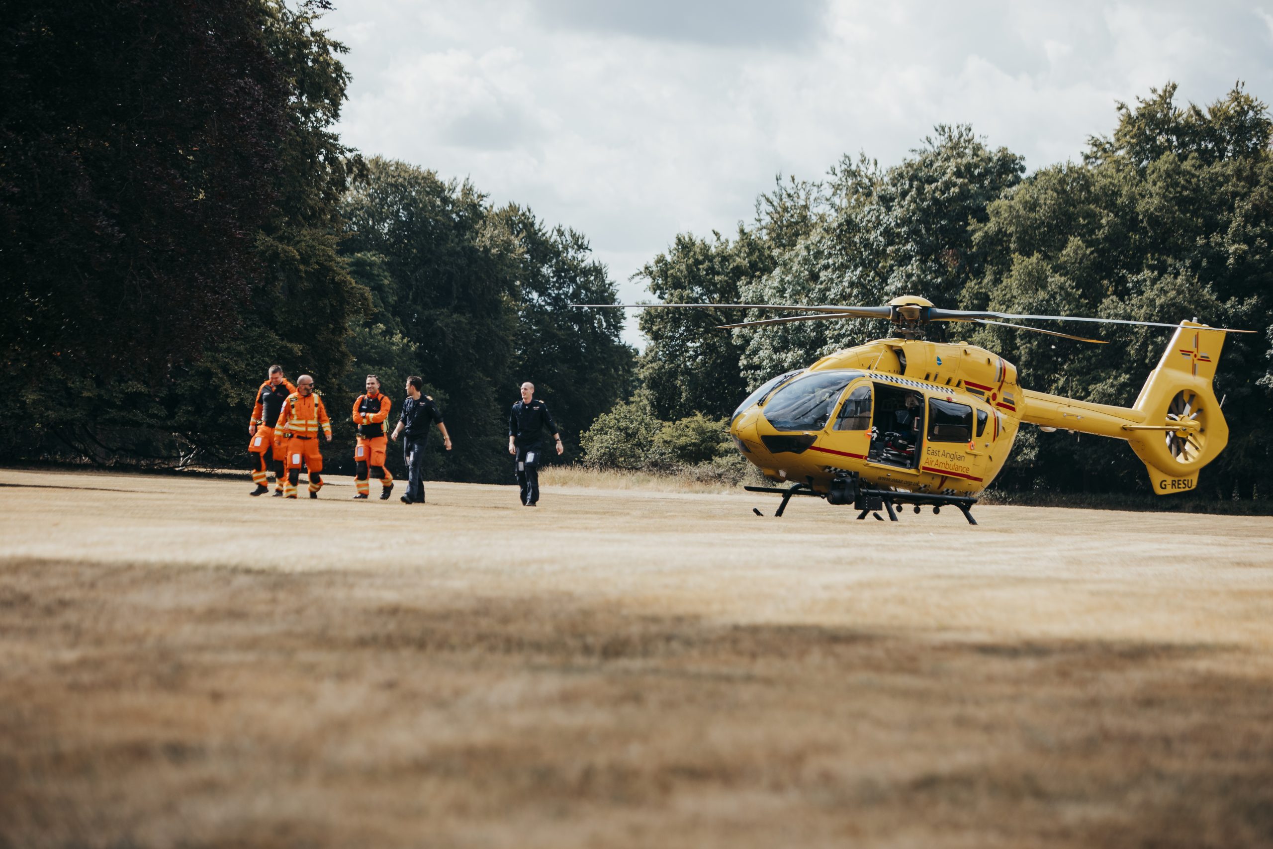 Anglia One crew with helicopter at Elveden Hall in Thetford.