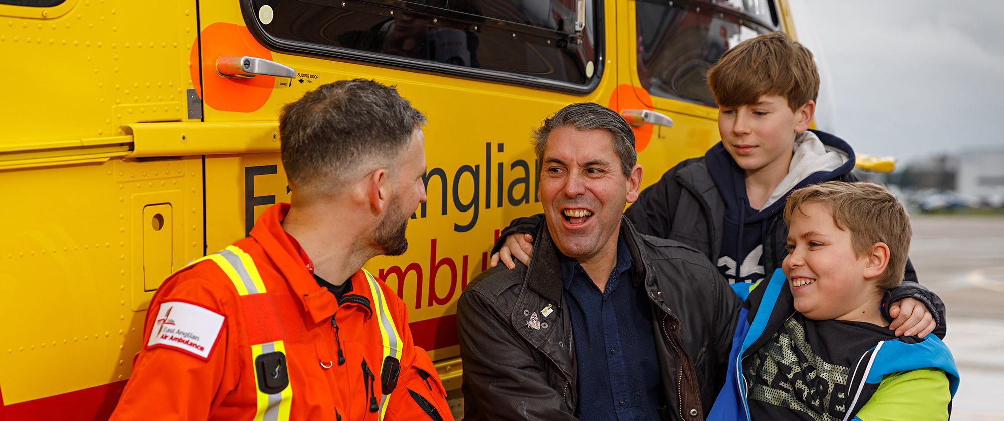 Former Patient Mark Youles and his sons with Dr Jim Flatt