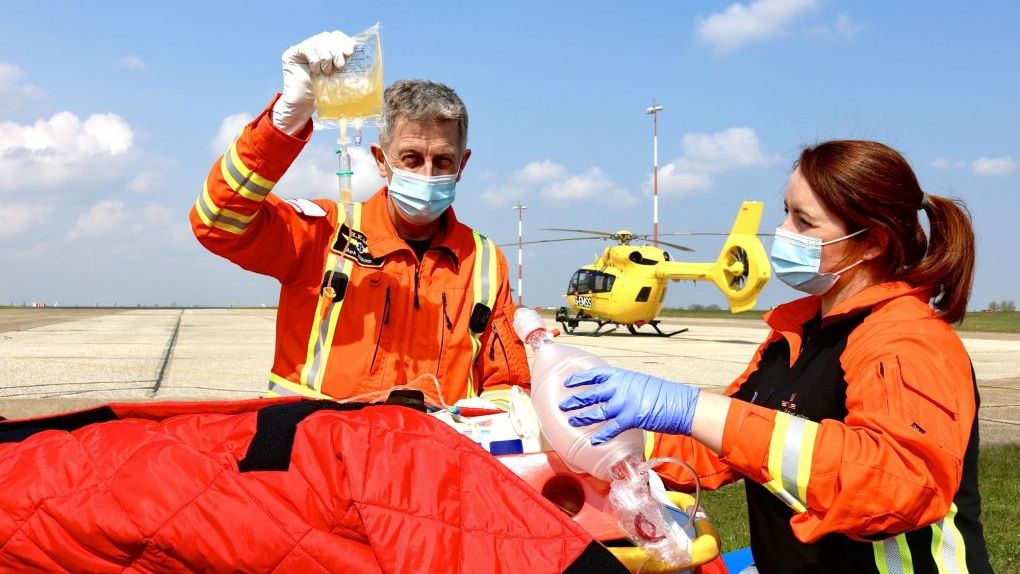 Critical Care Paramedic giving blood product