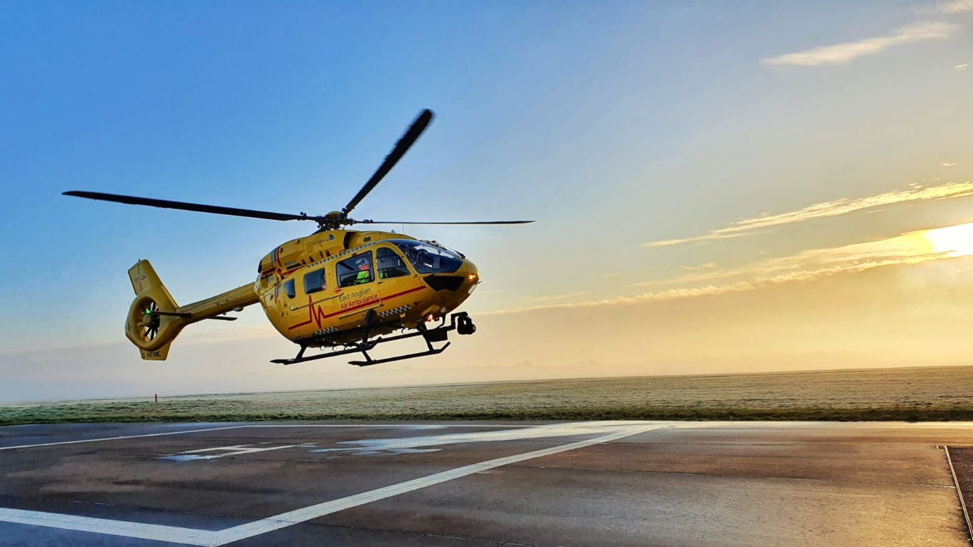 G-HEMC helicopter landing at sunrise