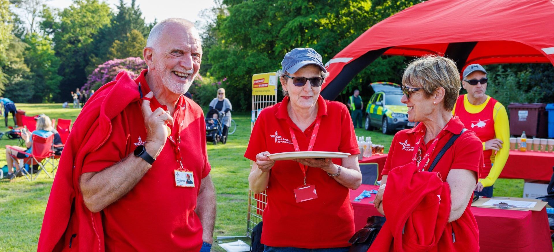 Three volunteers at an EAAA event