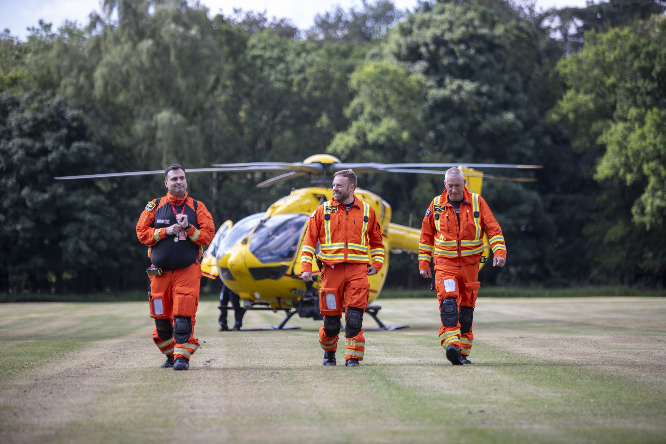 crew walking away from helicopter