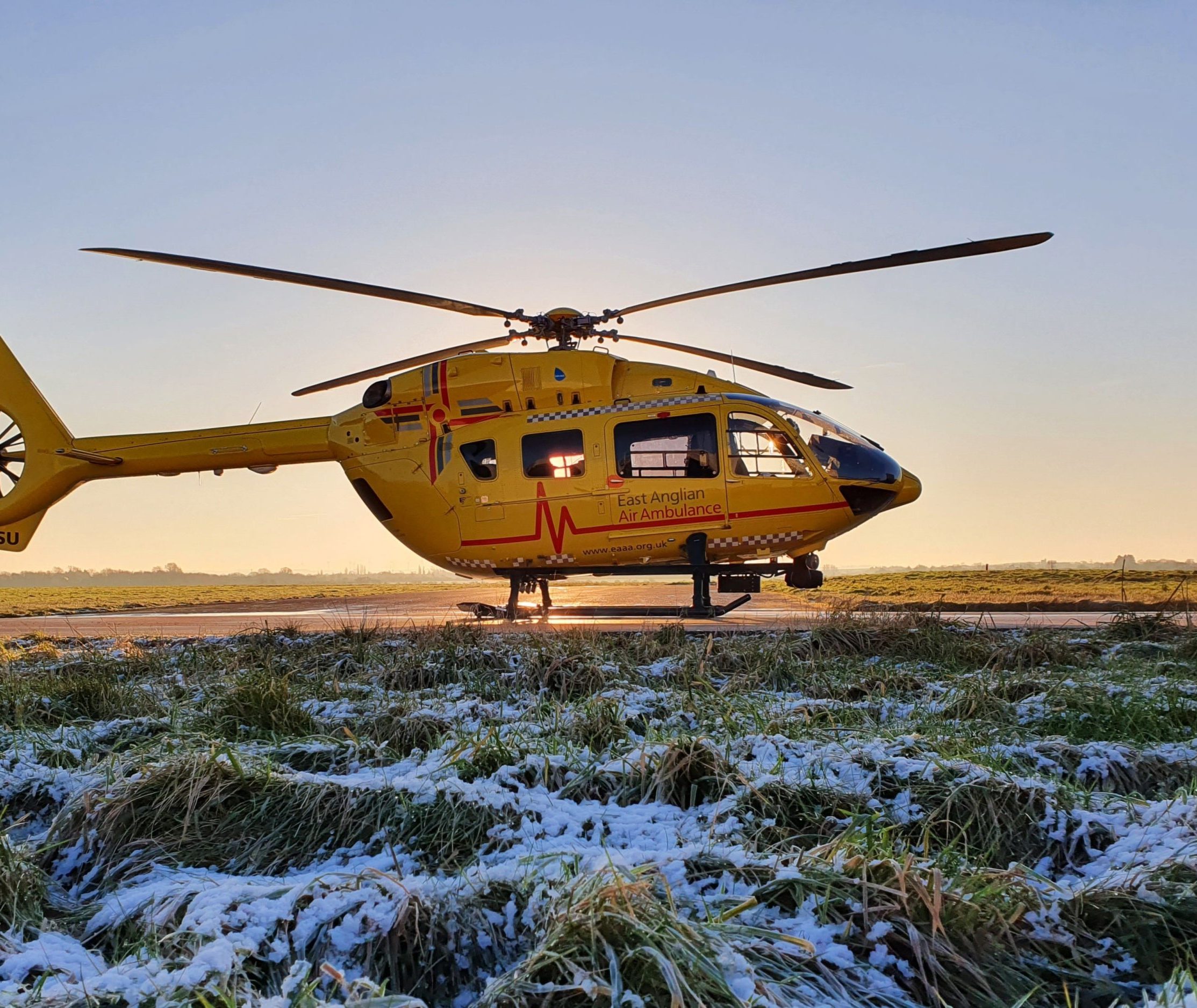 helicopter in snowy conditions at Cambridge airport