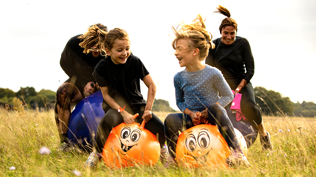 Two children on Space hoppers as part of Only the Brave Mini Muddy