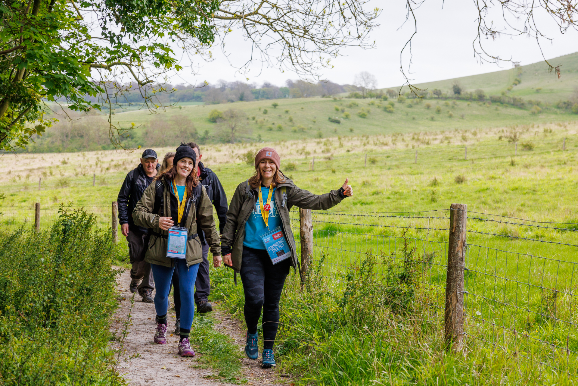 Trek Beds- Participants walking in a field