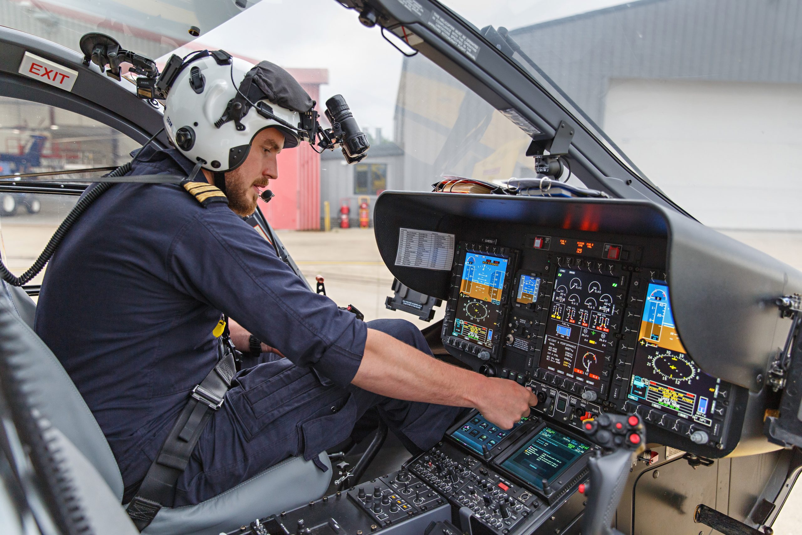 pilot in helicopter starting engine