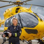 Captain Henrietta standing in front of helicopter