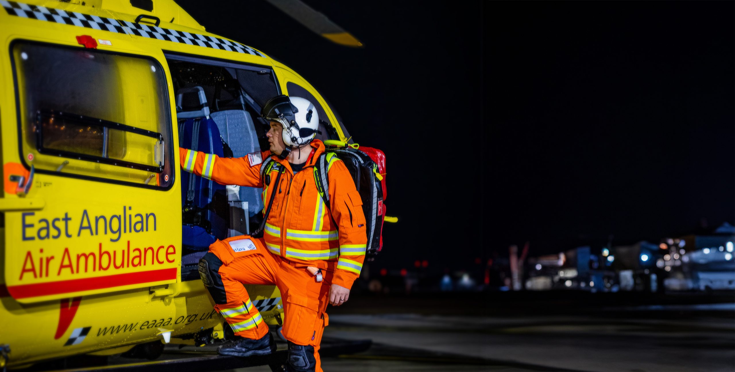 Josh getting into helicopter at night