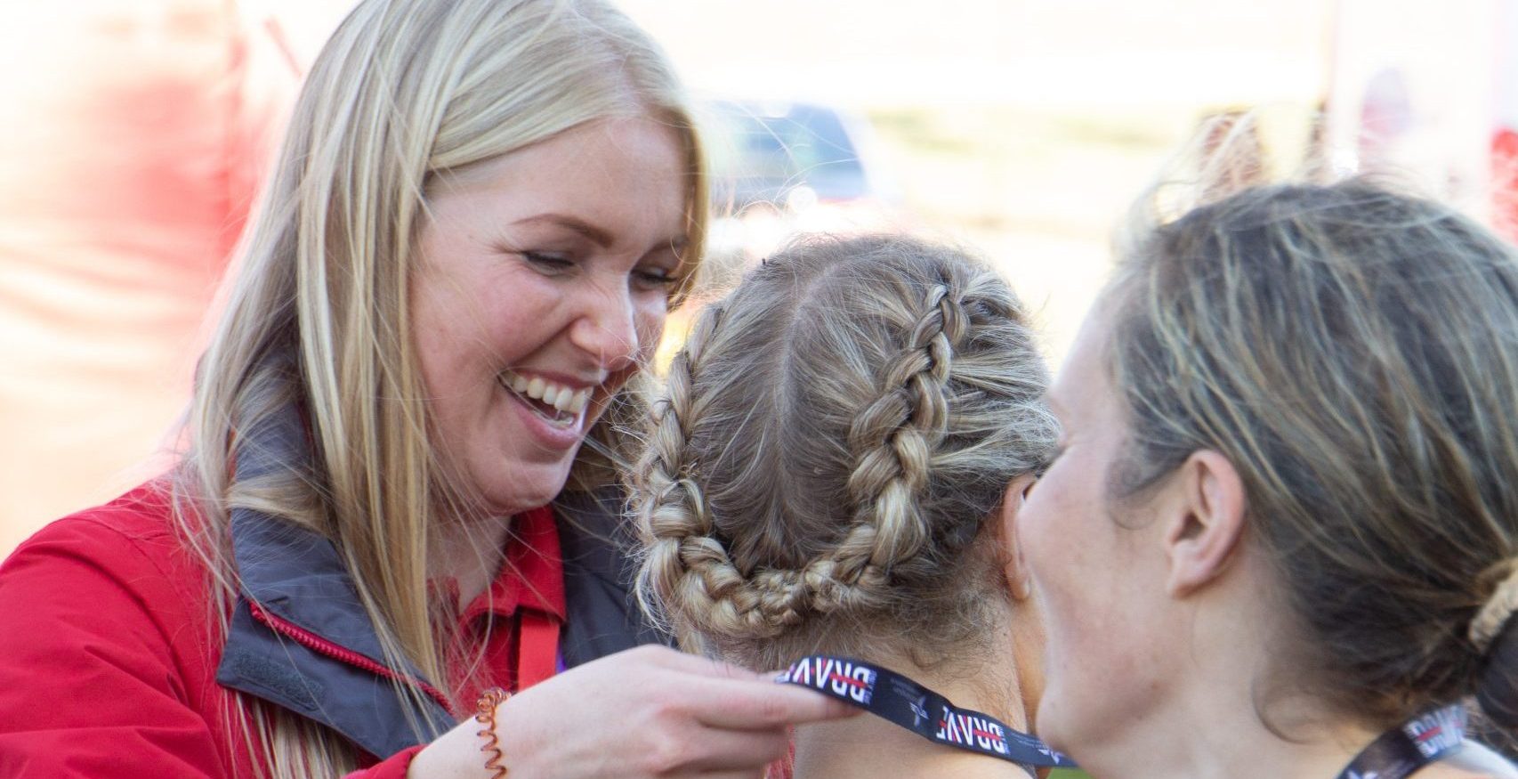 Handing out medals at OTB banner