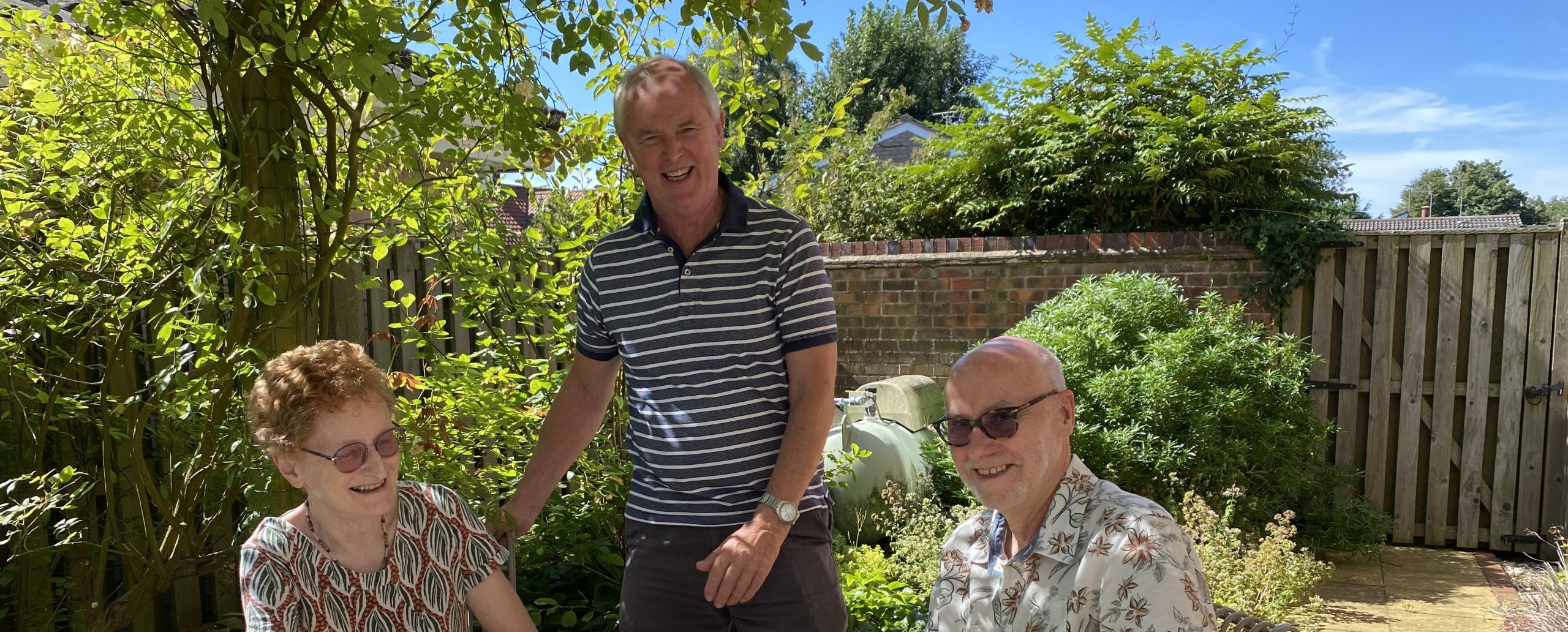 Marion, Dave and Andrew together in the garden several months after Marion's cardiac arrest.